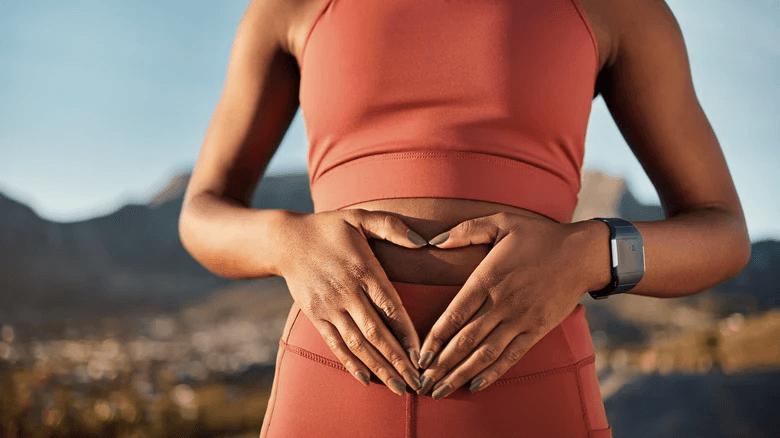 Woman holding stomach