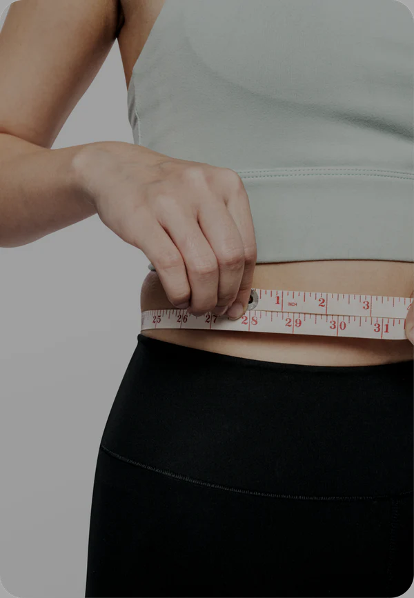 Woman experiencing relief from bloating with probiotic supplements